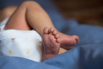 Little fingers. Legs newborn baby