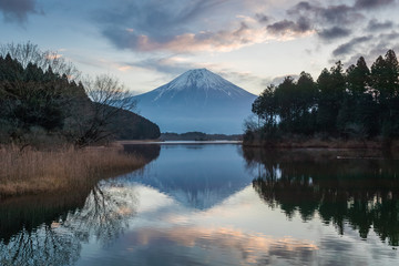 Mountain Fuji and Lake Tanumi with beautiful sunrise in winter season. Lake Tanuki is a lake near Mount Fuji.