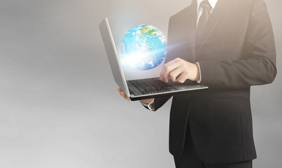  business man and suit holding laptop in hands