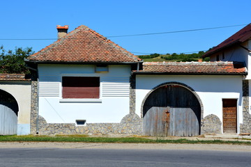 Typical rural landscape and peasant houses in Cincsor, Kleinschenk, Transylvania, Romania