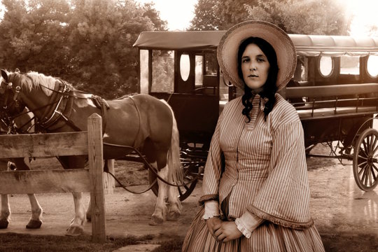 western colonial woman and amish carriage