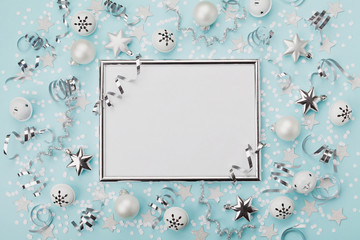 Party carnival christmas background decorated silver frame with confetti, balls and star on...
