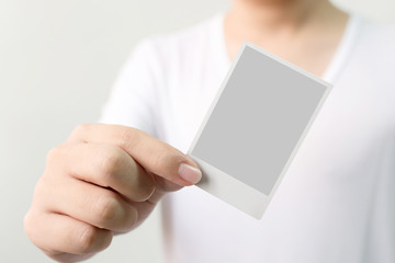 Hand of man holding photo frame, Clipping path included