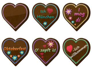 Traditional bavarian souvenir from Oktoberfest. Set of gingerbread heart. Translation: I love Munich, I like you, Octoberfest, welcome, It's tapped!