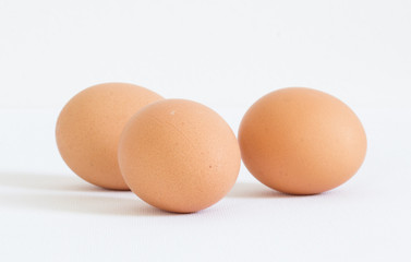three eggs on white background