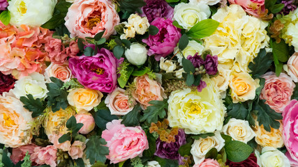 Beautiful flower field yellow green white pink purple and red lot of roses and peonies stand in