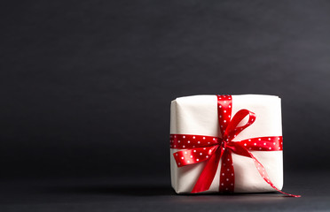 Handmade present box on a black background
