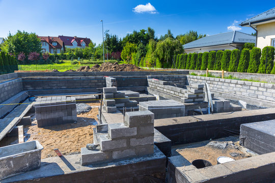 Brick up concrete blocks for foundation of a house