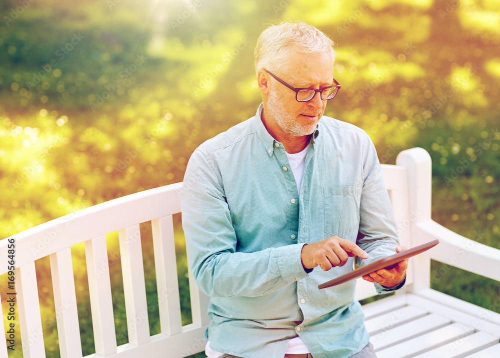 Sticker senior man with tablet pc at summer park