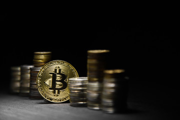 Golden bitcoin on black background. conceptual image for crypto currency.