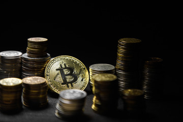 Golden bitcoin with money coins background. Bitcoin on black background