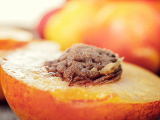 Fresh ripe nectarine peach fruit, crop rustic background