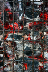 A close-up shot of charcoal burning in a barbecue grill