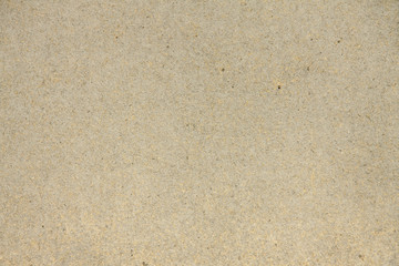 Vintage texture of granular heavy cardboard, packing kraft paper beige background