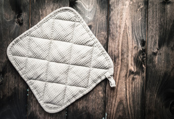 Potholder on a wooden background
