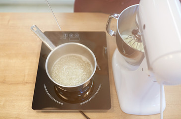electric mixer and pot on stove at kitchen