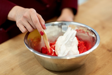 chef making macaron batter at confectionery