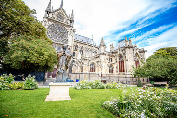 Side view on the Notre Dame church during the cloudy weather in Paris