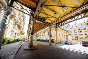 View on the old iron bridge with beautiful buildings in Paris