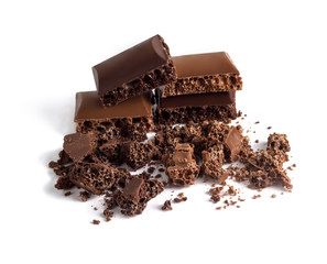 Pieces of black and chocolate porous chocolate