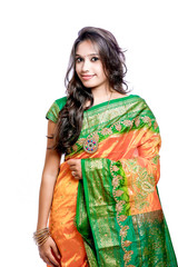 Happy young beautiful traditional Indian woman in traditional saree