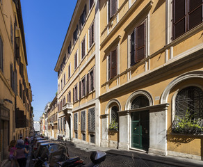 Small street and old buildings with beautiful ancient facades in