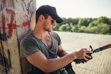 Portrait of Pensive American Soldier Resting from Military Operation Indoor Ruins Location
