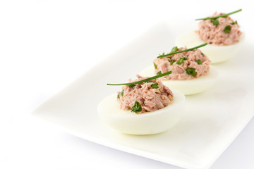 Stuffed eggs with tuna isolated on white background

