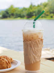 ice coffee with curry on wooden table.