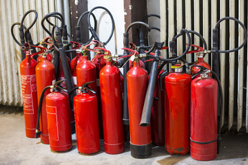 Many red fire extinguishers