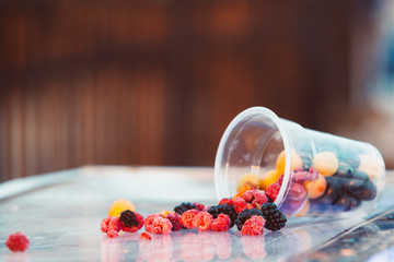Fruit in a plastic cup. Street trading. Street food.