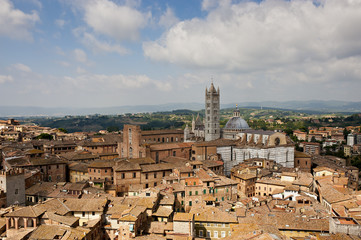 The Duomo of Siena and panorama of the city, Siena. Tuscany district. Italy