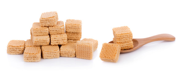 Milk wafers cubes on spoon isolated