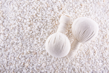 Spa. Still life. Herbal balls  on a background of white pebbles.