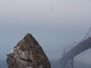Golden Gate Bridge seen in fog from Marin Headlands side fo the bay