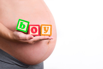 Pregnant woman holding boy word 
