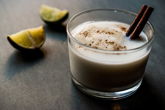 Horchata with Cinnamon stick and lime.