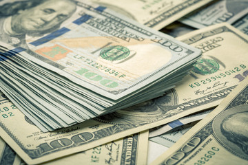 Lot of one hundred dollar bills close-up background