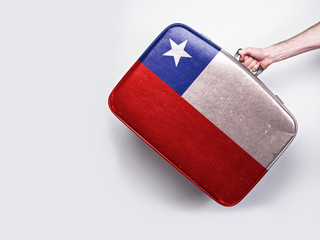 Chile flag on a vintage leather suitcase.