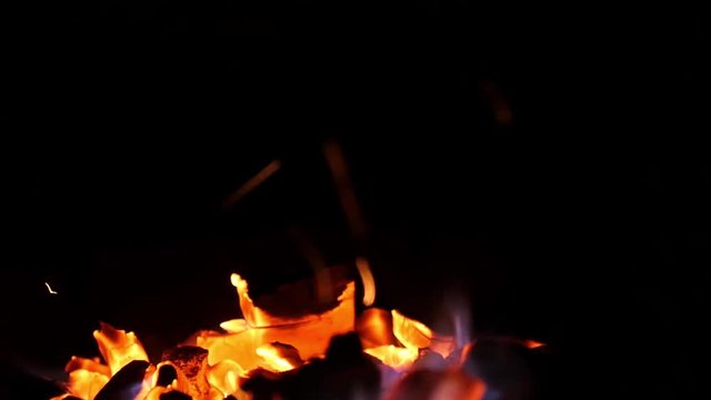 Fire in the night on black background. Bokeh from the fire changes focus to blurred. 1920x1080