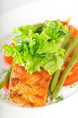 Fried fish with vegetables.