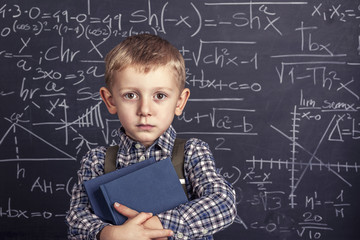 school boy and blackboard