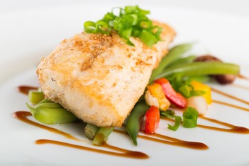 Fried fish with vegetable.