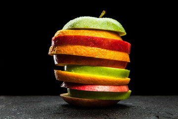Fruit slices on black background