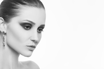 Fototapeta premium professional luxury female makeup on white background with copy space, monochrome