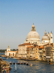 Fototapeta na wymiar Grand Canal with gondolas and the Basilica di Santa Maria della Salute in the background (Venice, Italy)