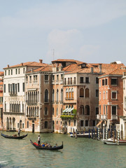 Gondolas and historic buildings in the Gran Canal in Venice, Italy