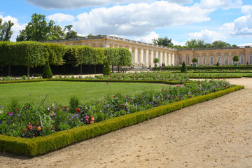 the grand trianon palace in versailles park