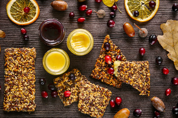 Autumn still life with honey and berries on wooden background