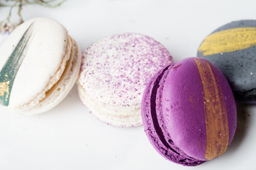 colorful macaroon cakes  against white background
